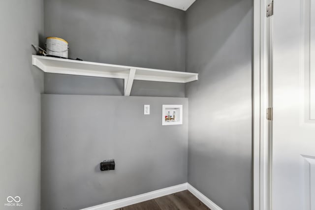 laundry area with dark wood-type flooring, washer hookup, and electric dryer hookup