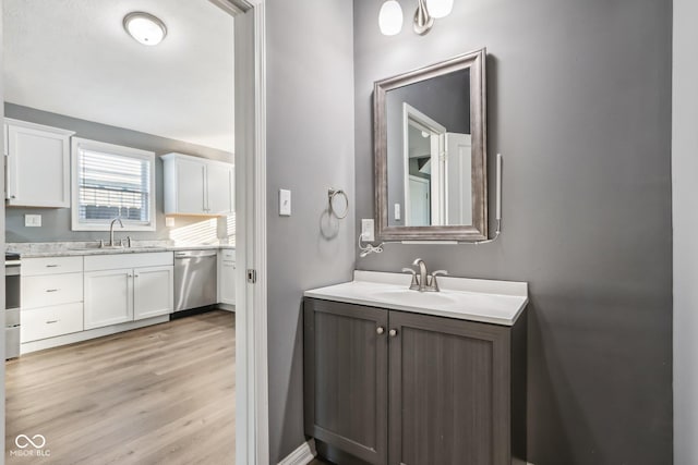 bathroom featuring vanity and hardwood / wood-style floors