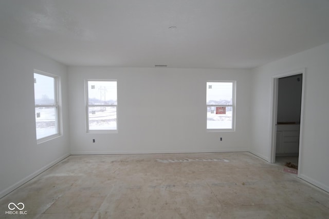 spare room featuring plenty of natural light