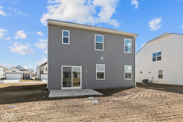 back of house with central AC and a patio