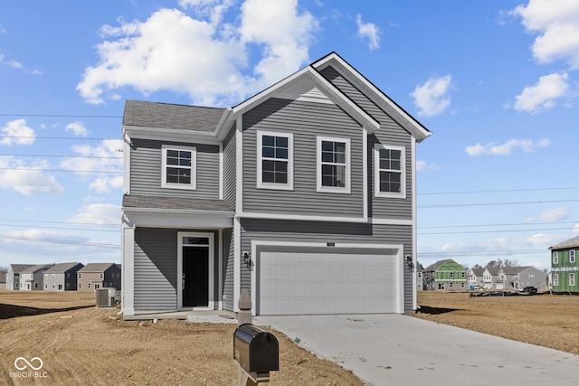 view of front of home featuring central AC unit, driveway, an attached garage, and roof with shingles