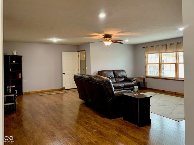 living room with hardwood / wood-style floors and ceiling fan