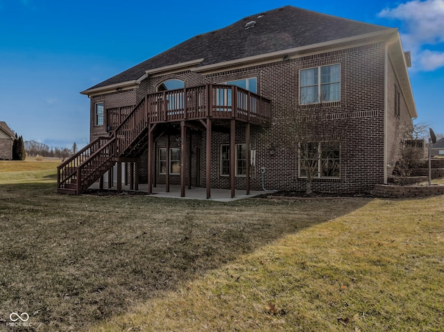 back of house featuring a yard, a patio, and a deck