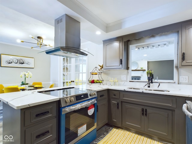 kitchen featuring sink, kitchen peninsula, island range hood, crown molding, and stainless steel electric range