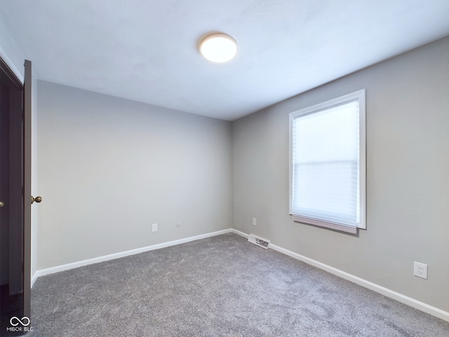 unfurnished room with carpet floors