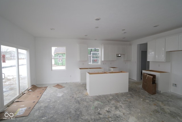 kitchen featuring a center island and white cabinets