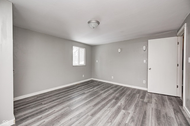 empty room with hardwood / wood-style floors