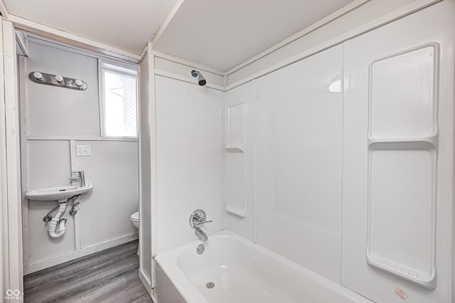 full bathroom with sink, bathtub / shower combination, toilet, and hardwood / wood-style floors