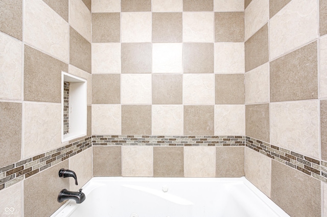 bathroom featuring a washtub