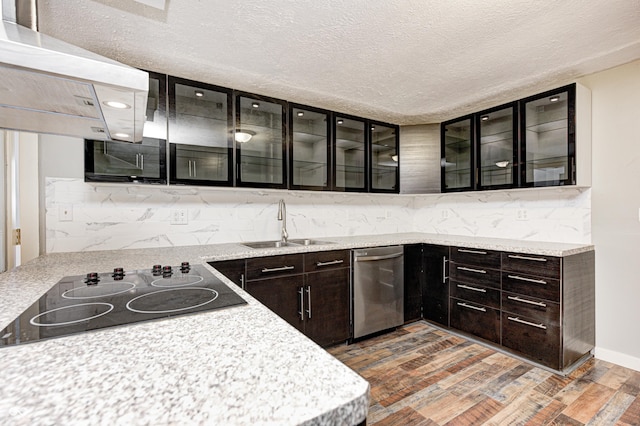 kitchen featuring black electric cooktop, dark wood-type flooring, wall chimney exhaust hood, stainless steel dishwasher, and sink