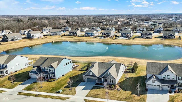 aerial view with a residential view and a water view