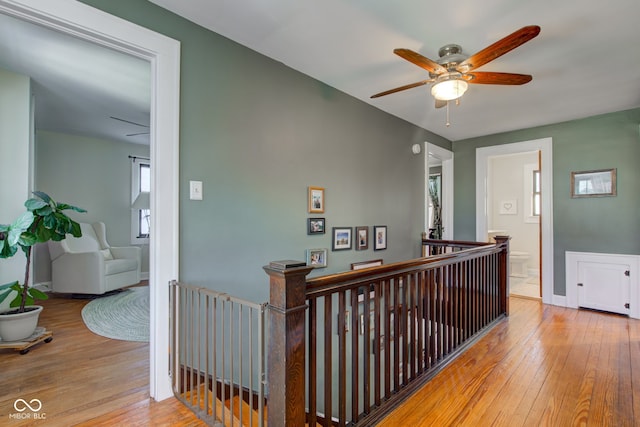 hallway with light hardwood / wood-style flooring