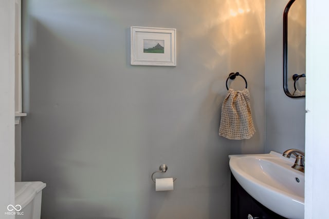 bathroom featuring sink and toilet