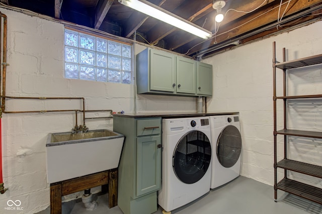 laundry area featuring cabinets and washer and clothes dryer