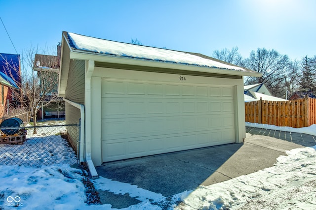 view of snow covered garage