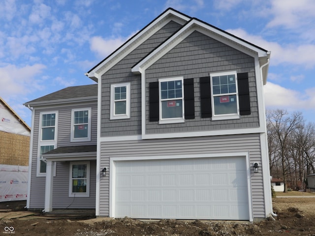 view of front of property with a garage