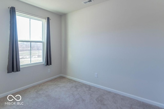 empty room featuring light colored carpet