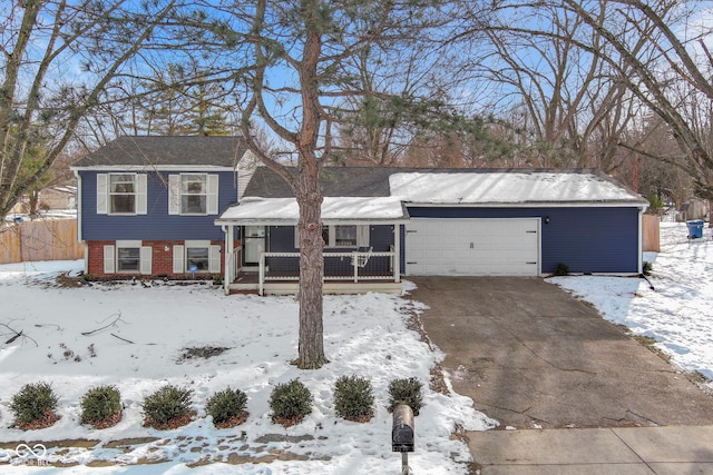 view of front of property with a porch and a garage