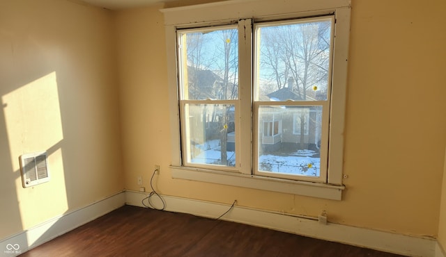 empty room with dark wood-type flooring