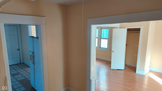 corridor featuring light hardwood / wood-style flooring