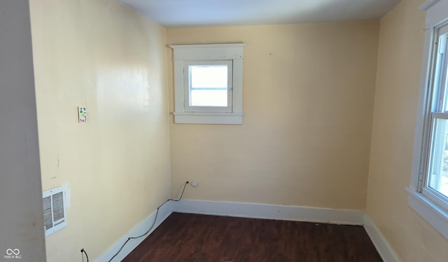 laundry area with dark hardwood / wood-style flooring