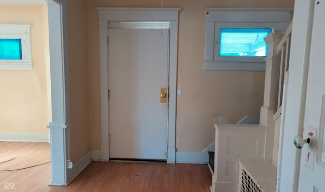 doorway to outside with light wood-type flooring