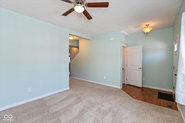 carpeted empty room with ceiling fan