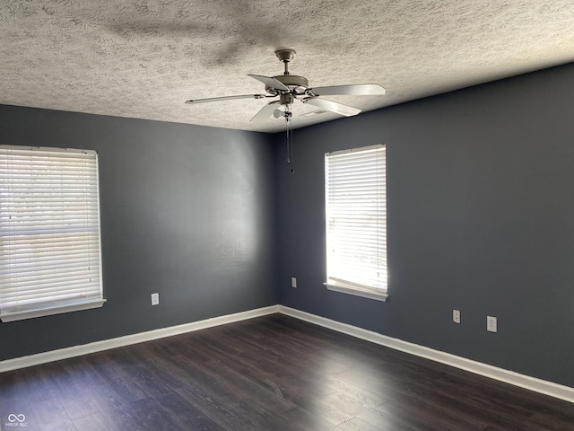 unfurnished room featuring ceiling fan, a textured ceiling, and dark hardwood / wood-style floors