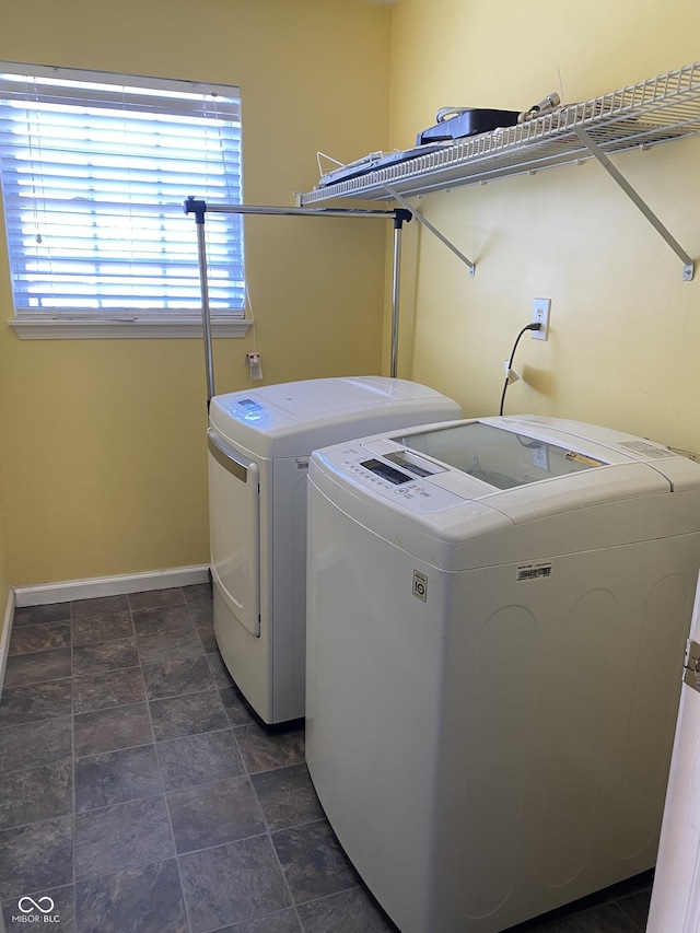 clothes washing area featuring washing machine and dryer