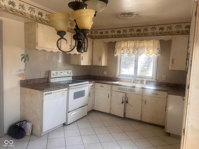 208 Winding Dr, Alexandria, IN 46001 - kitchen with sink, white appliances, light tile patterned floors, and cream cabinets