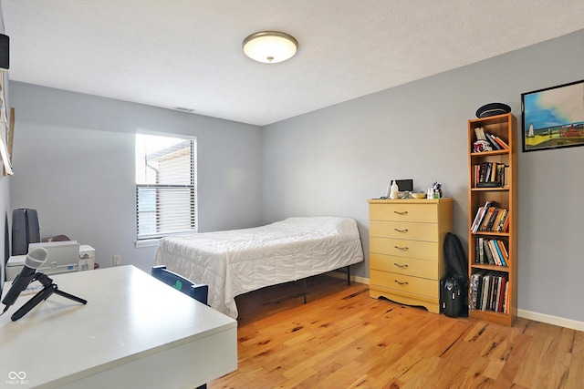 bedroom featuring light hardwood / wood-style flooring