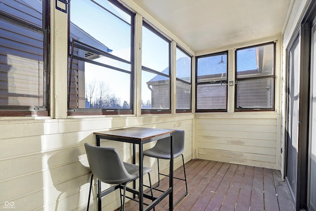 sunroom / solarium featuring a healthy amount of sunlight