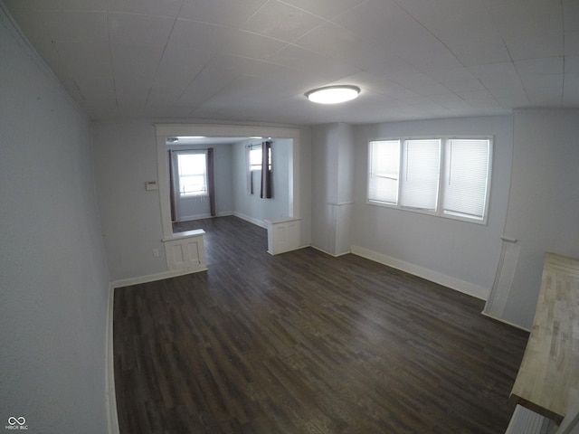 empty room featuring dark wood-type flooring