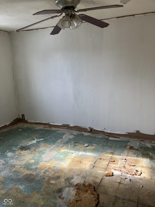 spare room featuring a textured ceiling