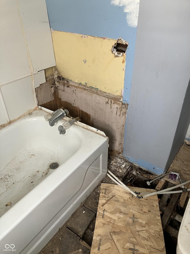 bathroom with a tub and sink