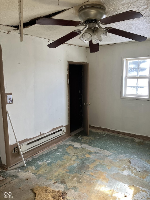 unfurnished room featuring a baseboard heating unit