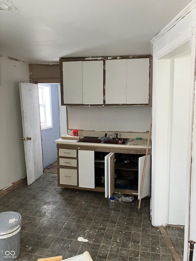 kitchen with white cabinets and sink