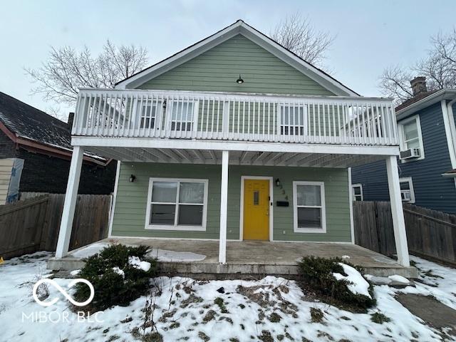 front facade featuring cooling unit and covered porch