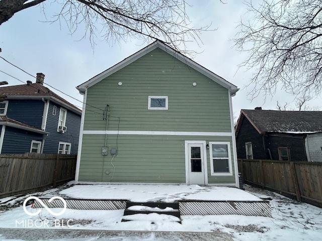 view of snow covered house