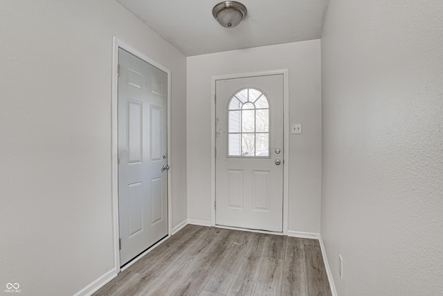 entryway with light hardwood / wood-style floors