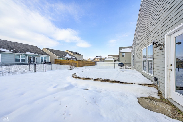 view of yard layered in snow