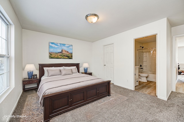 carpeted bedroom with connected bathroom