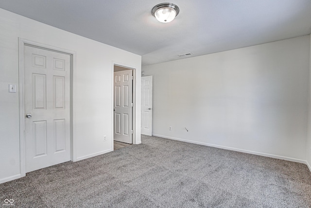 unfurnished bedroom featuring carpet flooring