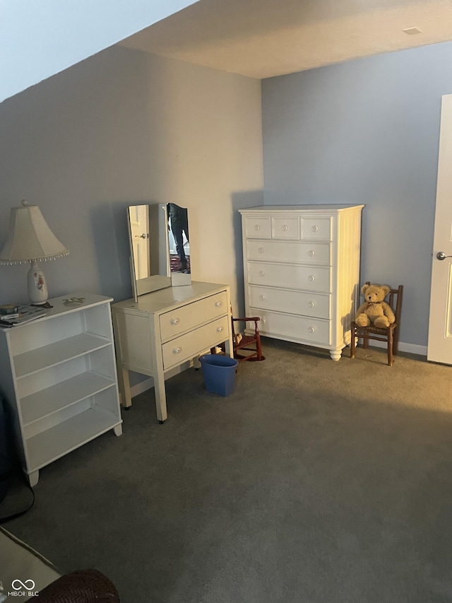 bedroom with dark colored carpet