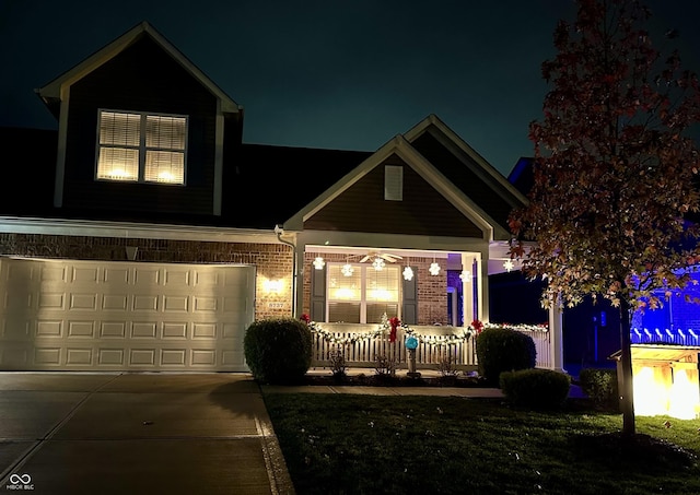 view of front of property with a garage and a porch