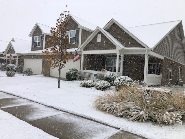 view of front of home featuring a garage and covered porch