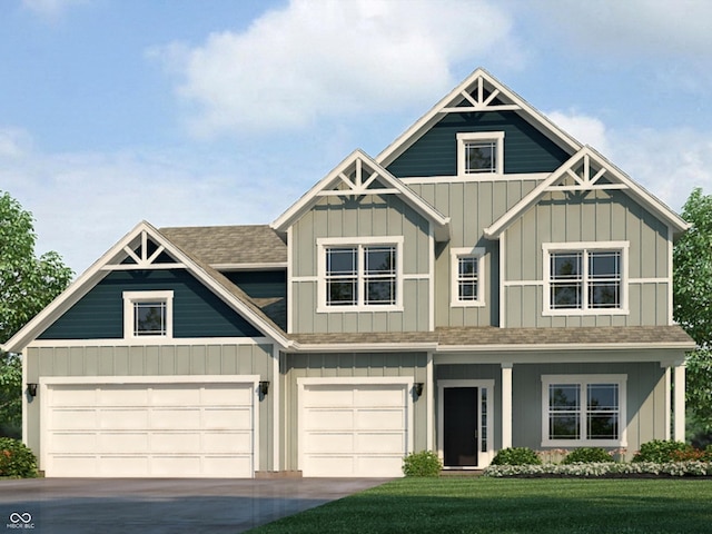 craftsman-style house featuring a front lawn and a garage