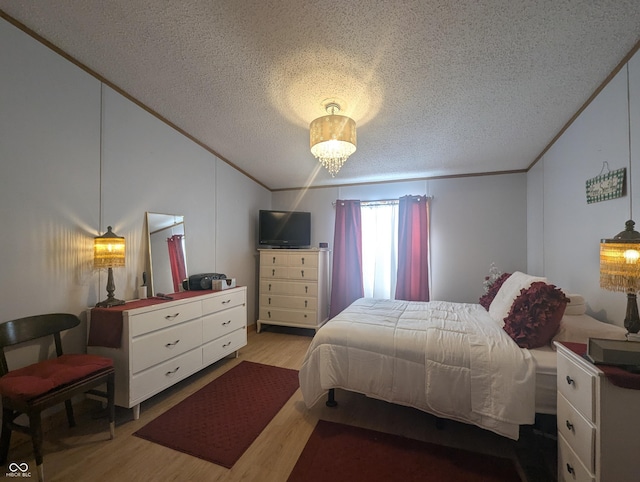 bedroom with lofted ceiling, a chandelier, a textured ceiling, ornamental molding, and light hardwood / wood-style floors