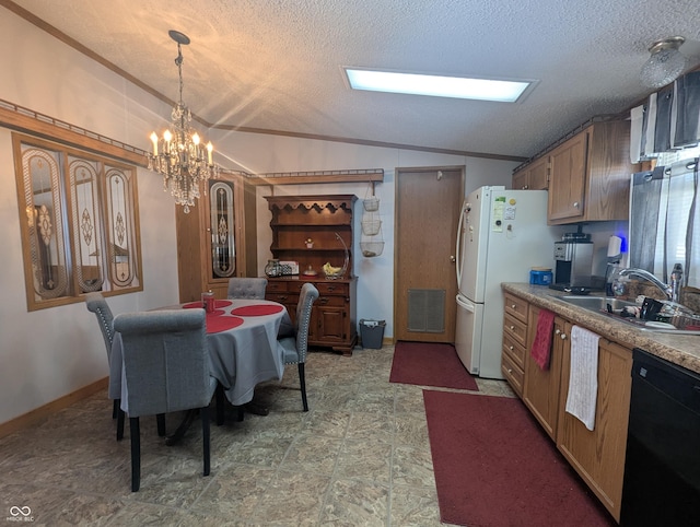 dining room featuring an inviting chandelier, lofted ceiling, sink, and a textured ceiling