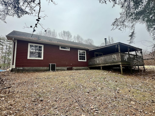 back of property with a wooden deck